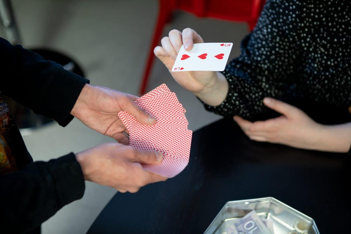 Person doing a magic card trick